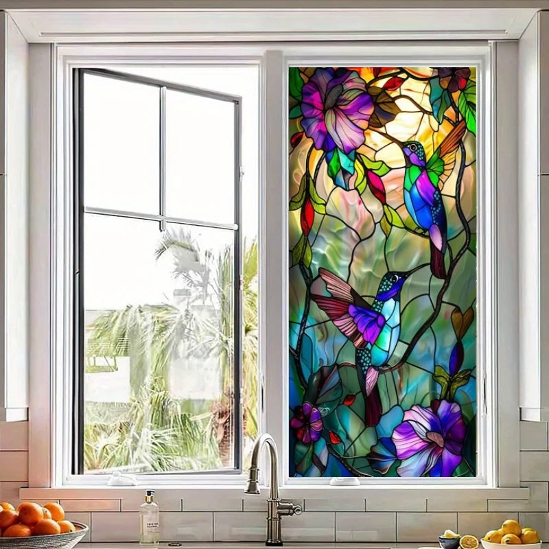 A window featuring a stained glass design of colorful hummingbirds and floral patterns.