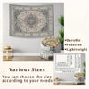 A large, ornate tapestry featuring celestial stars and a moon design displayed on a wall.