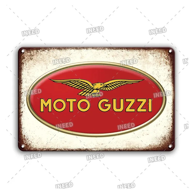 Vintage metal sign with a red oval featuring a golden winged motorcycle logo and the text MOTO GUZZI