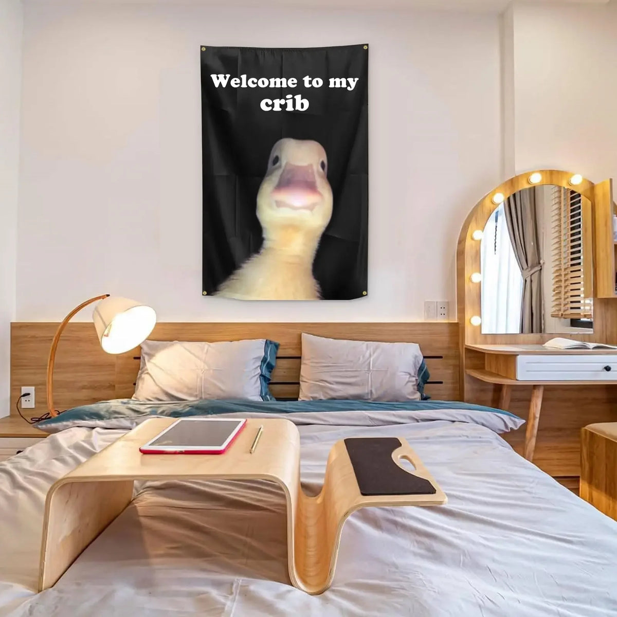 A black flag featuring a white, smiling crib mascot for home decor.