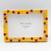 A yellow and pink block photo frame decorated with star shapes, ready for DIY photo display.