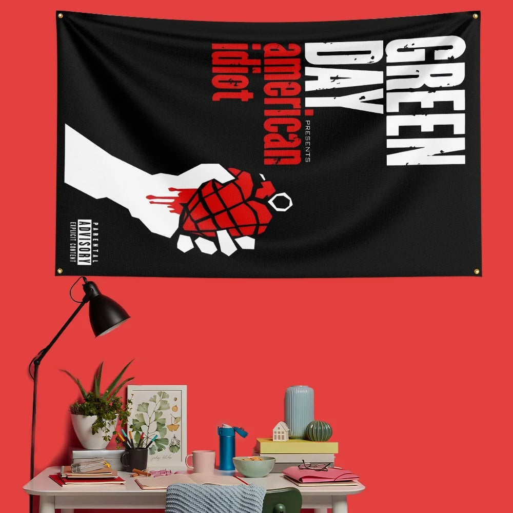 A black banner featuring the text 'Green Day Day' in white and red, with a hand graphic.