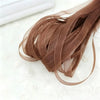 A bundle of 10 yards of brown decorative fishtail yarn ribbon laid on a white surface.