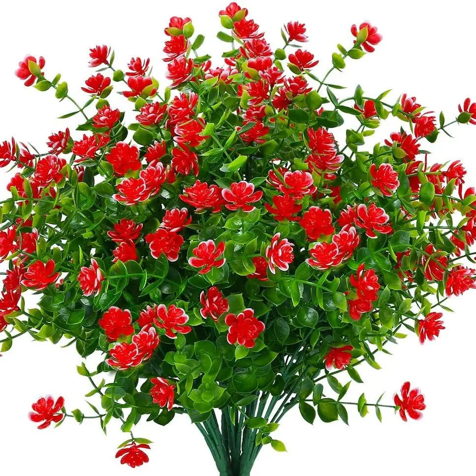 باقة من نباتات اصطناعية حمراء وخضراء.