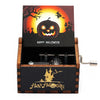 A carved wooden music box featuring a Halloween-themed box with a jack-o'-lantern design and spooky silhouette.