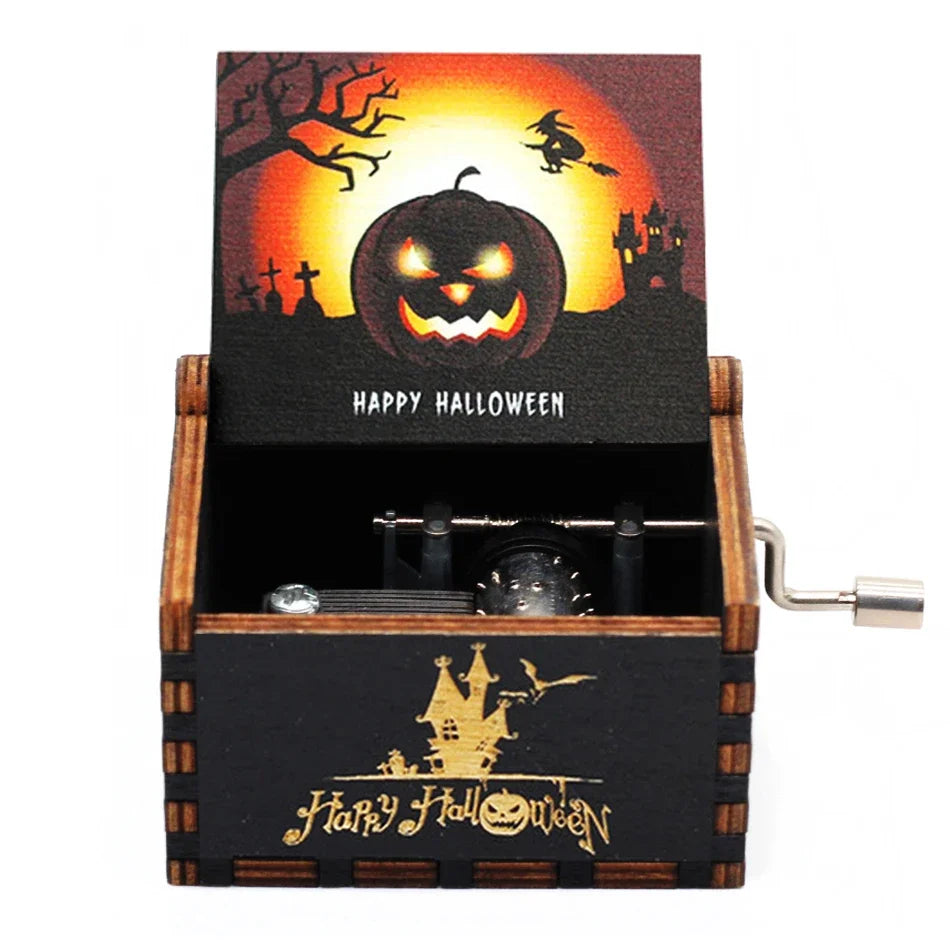 A carved wooden music box featuring a Halloween-themed box with a jack-o'-lantern design and spooky silhouette.
