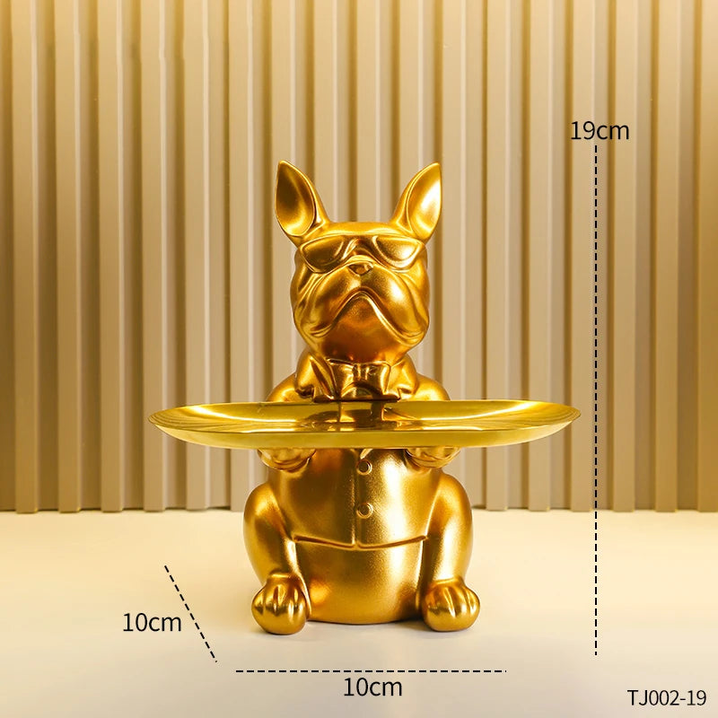 A golden decorative bulldog tray featuring an animal motif, shown against a striped background.