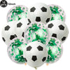 A pack of 10 black and white soccer ball balloons with green confetti decorations.