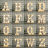 A grid of luminous LED alphabet night lights displaying the letters A through Z.