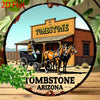 Vintage western tombstone sign plaque featuring a wooden building and horses in an old west style.