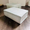 A white, rectangular silicone mold shaped like an open book for resin and concrete DIY projects.
