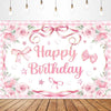 A pink and white floral birthday banner featuring a bow ribbon design on a wooden surface.