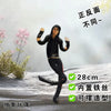 A black collectible plush doll of Michael Jackson in a dynamic pose, shown against a snowy background.
