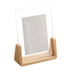 A walnut wood and acrylic photo frame designed for desktop display.