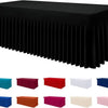 A collection of rectangular stretch tablecloths in various colors including blue, red, white, and pink.