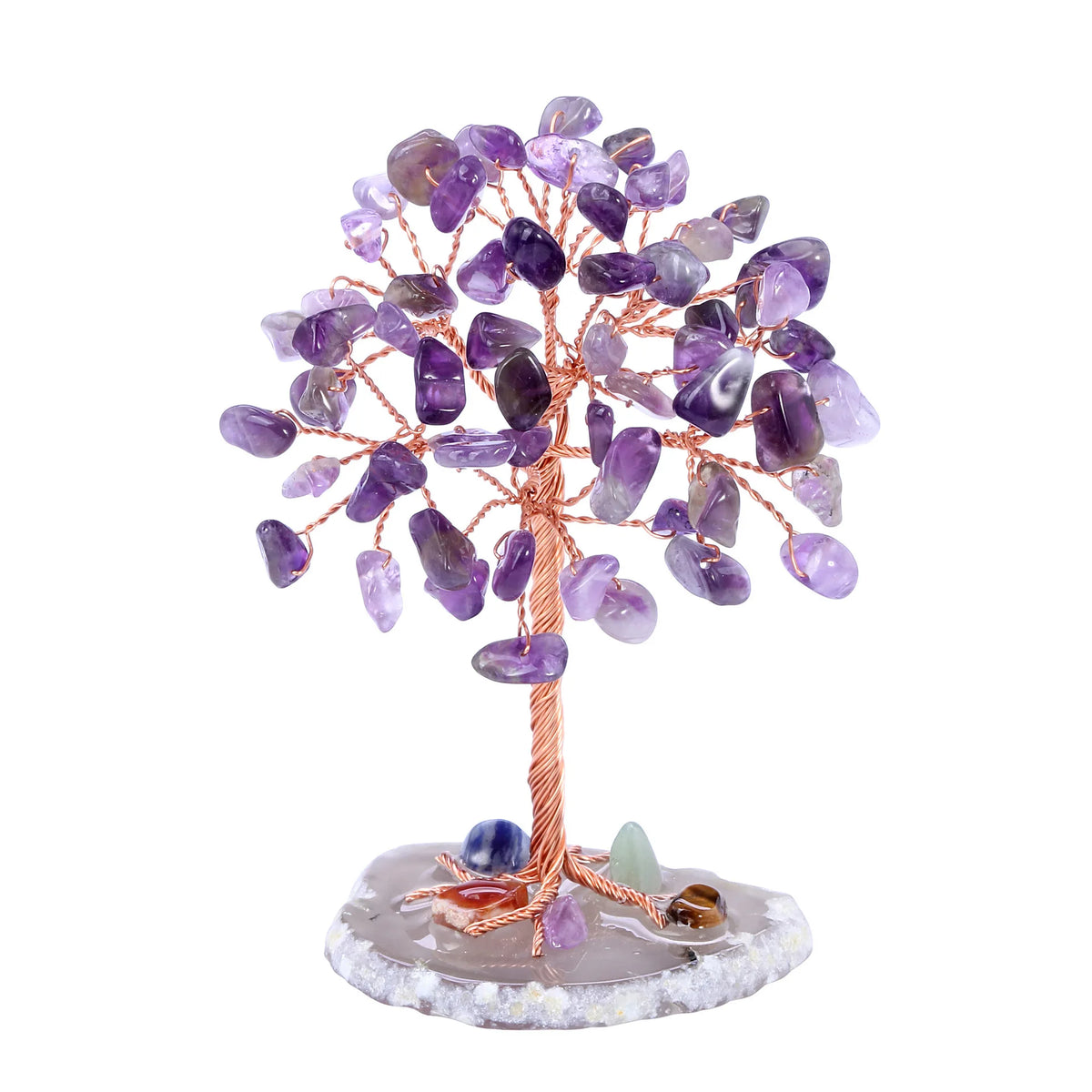 A crystal money tree decor featuring purple amethyst-like crystals on a wooden branch mounted on a stone base.