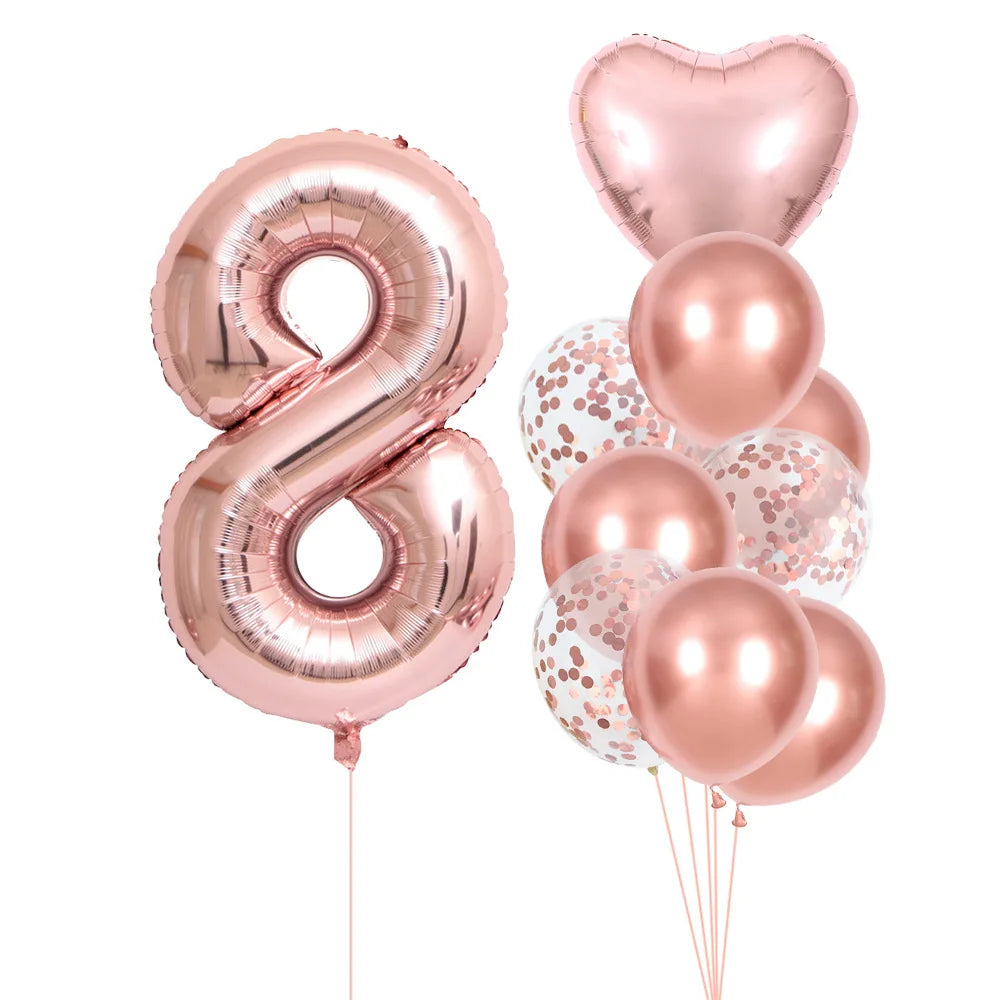 A set of rose gold foil balloons shaped like the number eight and several round balloons for party decoration