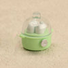 A small, light green kitchen appliance dollhouse accessory with a clear dome and white components.