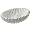 A white modern ruffle scalloped decorative bowl with vertical fluting.