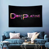 A dark banner featuring the text D'OR ET PLATINE in gold and pink lettering mounted on a wall.