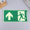 A rectangular photoluminescent emergency exit sign decal with a white upward arrow and a silhouette of a person walking.