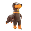 An inflatable dachshund dog costume for adults, brown and orange, standing upright.