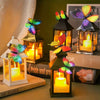 A set of twelve colorful 3D butterfly wall stickers displayed in glass lanterns with lit candles.