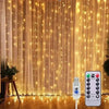 A vertical display of warm fairy curtain string lights illuminating a wooden floor.