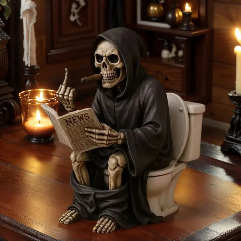 A resin statue of a skull wearing a hood reading the news, placed on a wooden desk.