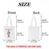 Front and back views of a white tote bag with a pink floral design printed on one side