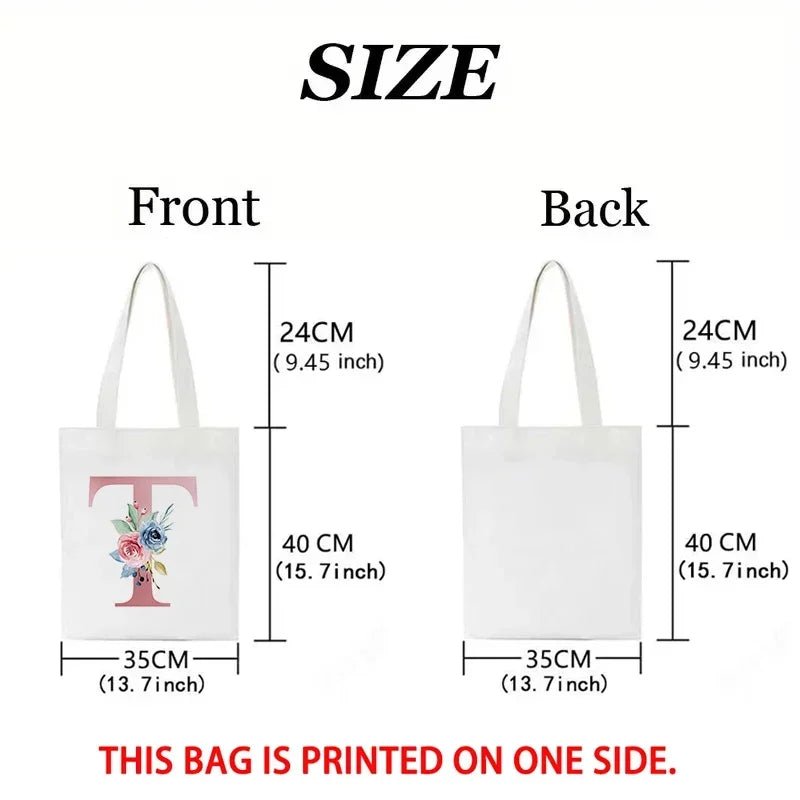 Front and back views of a white tote bag with a pink floral design printed on one side