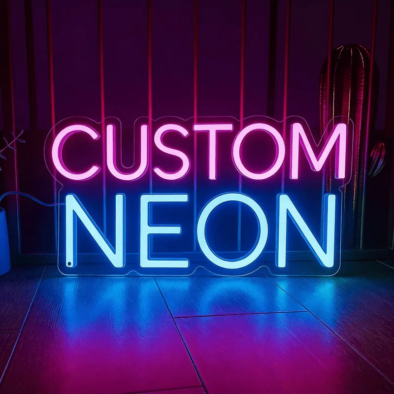 A glowing neon sign spelling CUSTOM NEON in bright blue and purple light against a dark background.