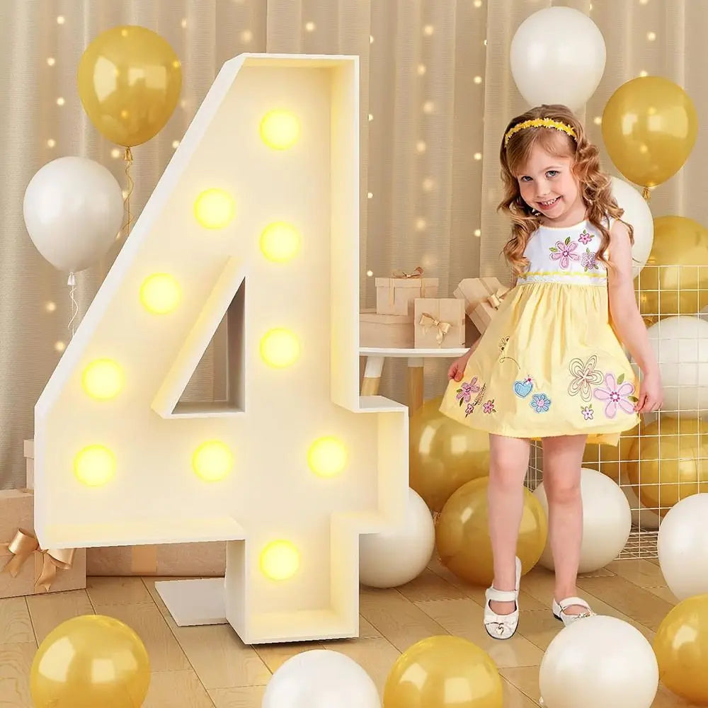 A large, illuminated number four made of white LED light-up balloons is displayed with yellow and white balloons for party de