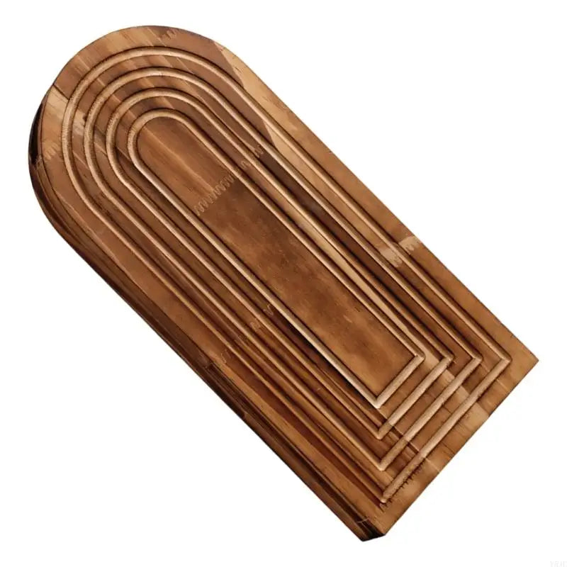 A wooden wall planter with a curved, ribbed design, featuring horizontal grooves and a tapered shape.
