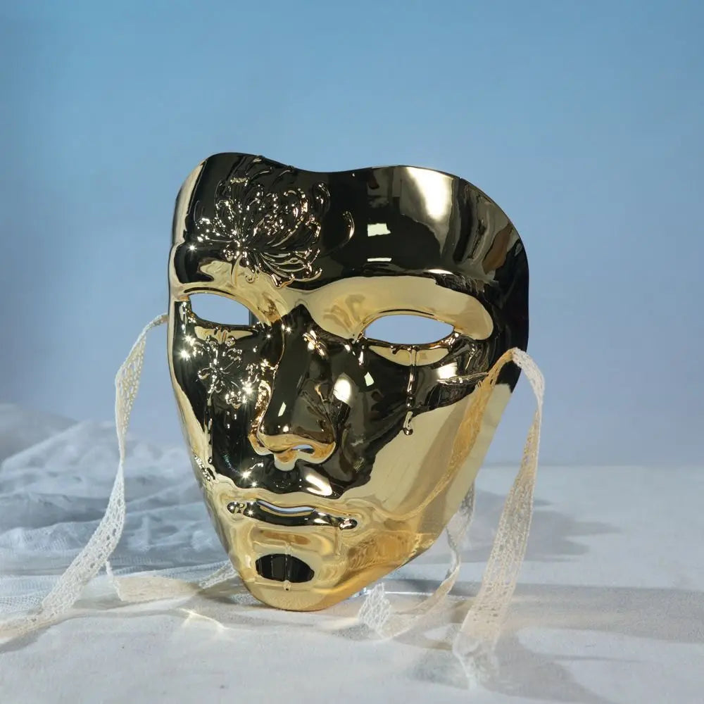 A shiny gold masquerade mask with an ancient style and hanfu-inspired design, displayed against a light background.
