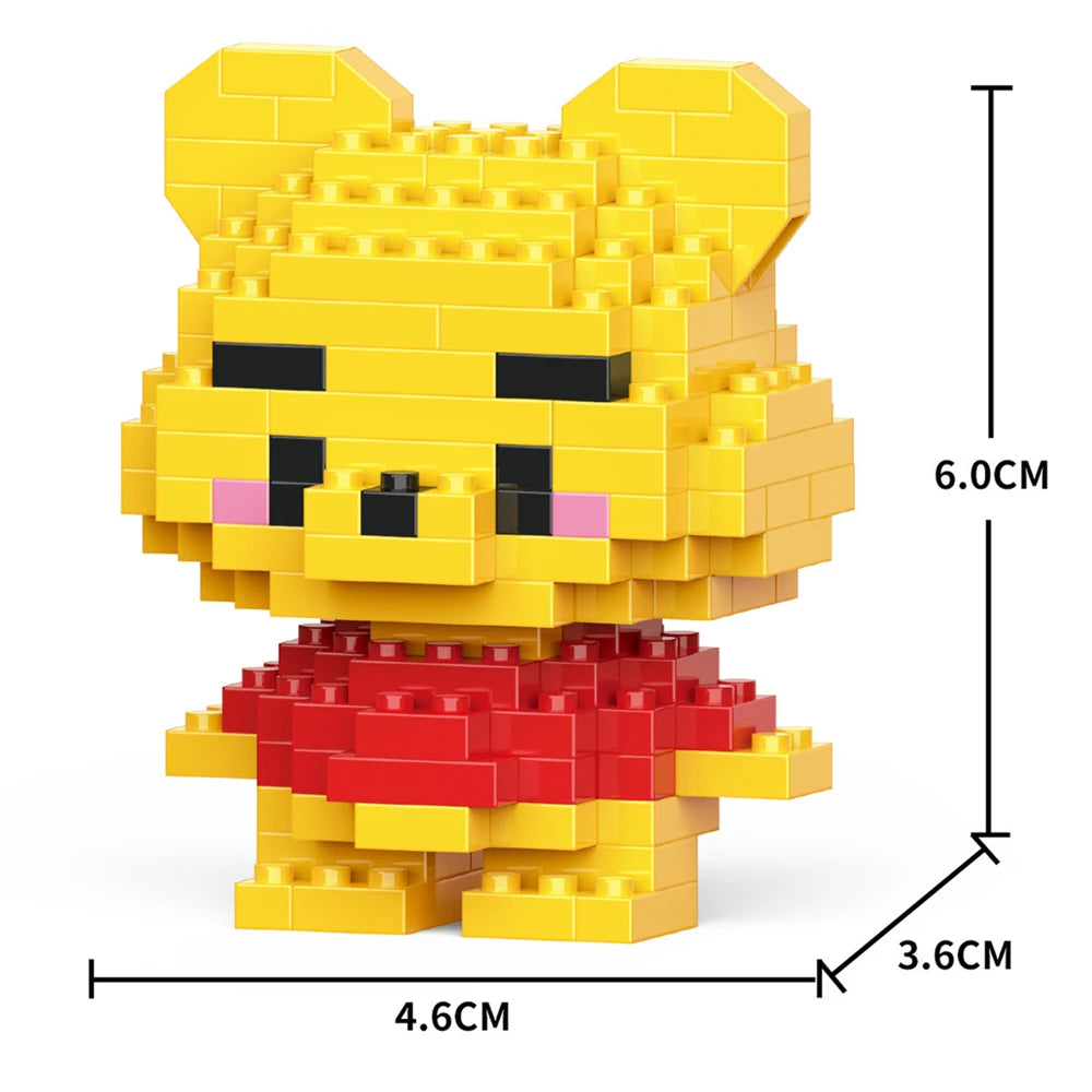 A yellow animal-themed building block model kit resembling a bear, with a red outfit and various dimensions marked.