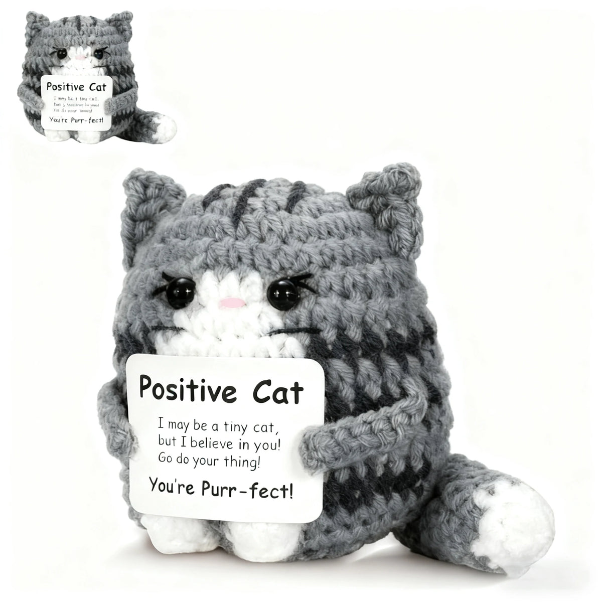 A gray knitted cat plush pendant with a pink nose and an attached card encouraging positive self-belief.
