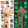 A collection of glow-in-the-dark Halloween temporary tattoos featuring various spooky and cute characters.