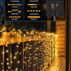 Outdoor fairy string lights illuminating a wooden fence with various lighting modes.