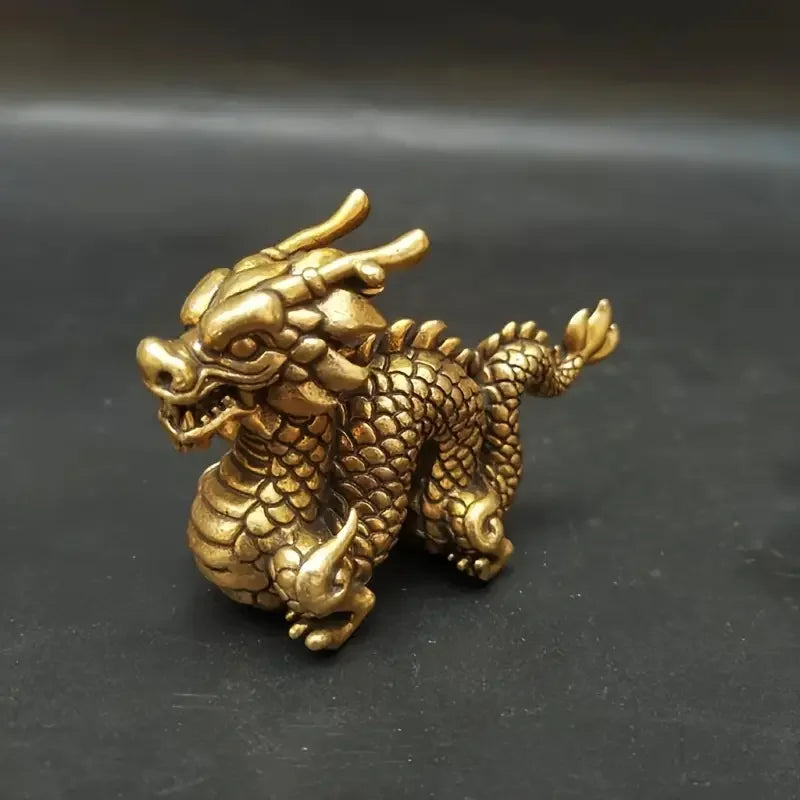 Handcrafted brass Chinese dragon statue with detailed scales and fierce expression.