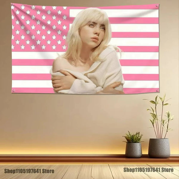 A blonde woman is featured on a pink and white striped tapestry banner with stars.