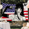 A tapestry featuring a stylized anime character with intense eyes pointing at an American flag.