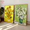 A framed painting featuring a vibrant yellow floral arrangement in a vase, displayed on a light-colored wall.