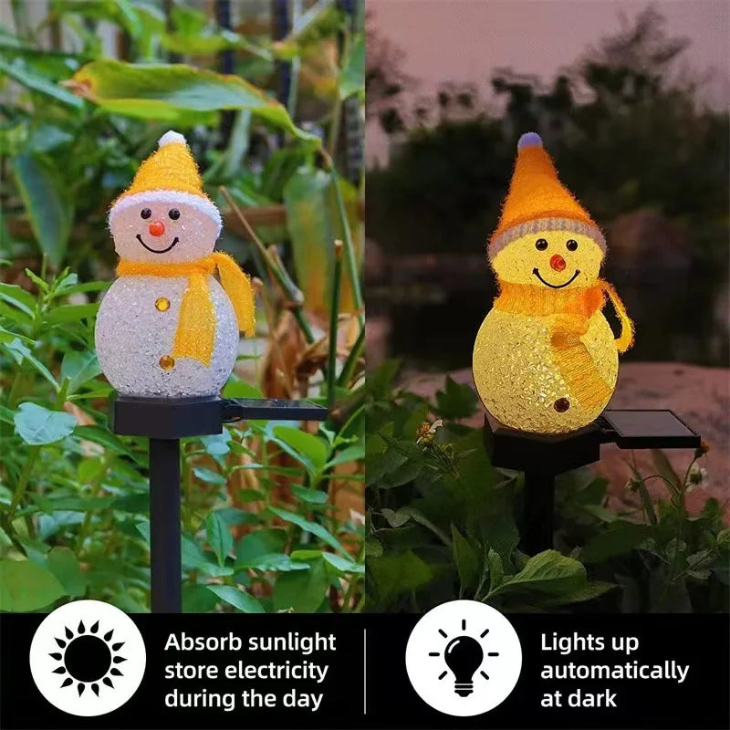 A yellow solar powered outdoor christmas snowman light illuminating a garden setting.