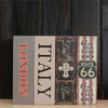 Three vertical books labeled London, Italy, and Get Your Kicks Route 66 displayed against a dark wooden background.