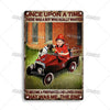 Vintage metal sign depicting a boy in a firefighter's outfit with a dog in a vintage red vehicle.