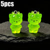 Five pairs of glow-in-the-dark green cartoon kitty duck resin charms displayed on a dark surface.