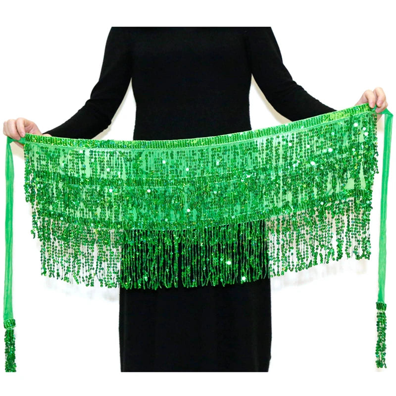 A green hula dancer layer skirt made of sequins with tassel belts displayed on a black dress.