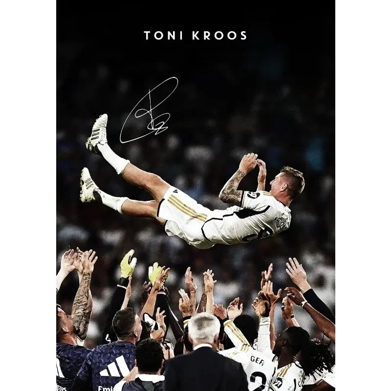 A black and white portrait of a soccer player in action, signed by Toni Kroos.