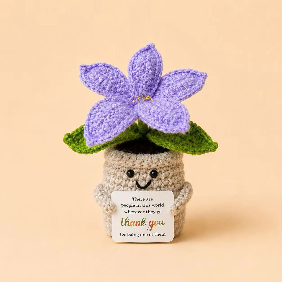Handcrafted crochet purple lily flower in a pot with a thank you card
